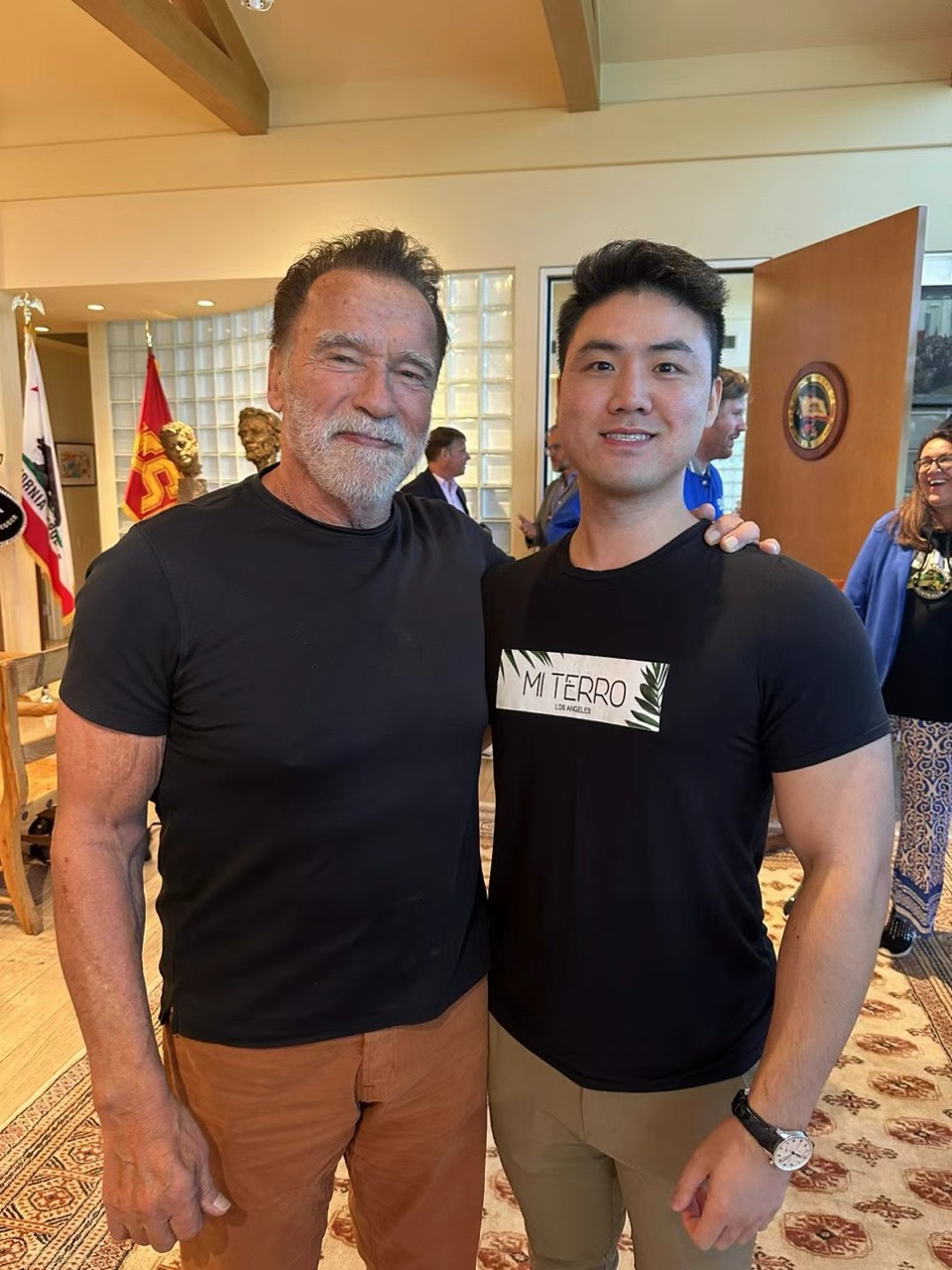 Robert at an event with Arnold Schwarzenegger